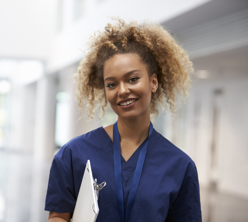 A certified tissue bank specialist smiling at the camera.